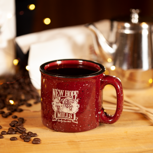 New Hope Mills red mug with coffee