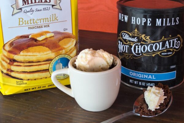 Prepared "Cake in a cup" recipe, with Ultimate Hot Chocolate and Buttermilk pancakes mixes in the background