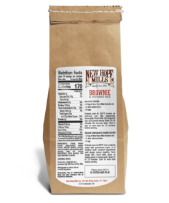 The back of a New Hope Mills Rich Chocolate Brownie & Cookie Mix bag. The packaging is brown Kraft paper with, with a white label, with black and red print. The left side displays the Nutrition Facts label detailing serving size, calories, and nutritional content, with ingredients listed below that. The right side has a large label with the product name, logo, and a brownie recipe. Below the recipe is additional product information including ingredients, manufacturer contact details, and a UPC barcode.
