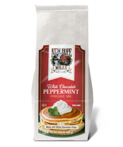 New Hope Mills White Chocolate Peppermint Pancake Mix in a white paper bag