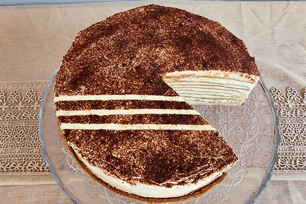 image showing finished product for Tiramisu Crepe Cake Recipe