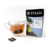 Stash Earl grey tea box with a cup of brewed tea