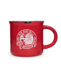 Photo of a simple red mug printed with the 200th Anniversary New Hope Mills logo in white